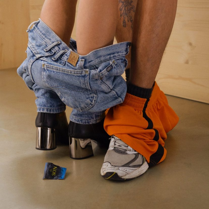 Naked legs of couple facing each other Naked legs of couple facing each other