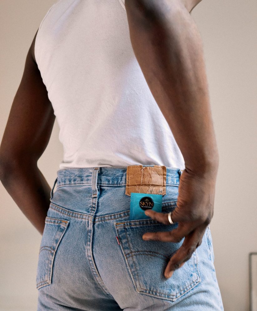 Man with SKYN Get Fresh Pocket wipes in his back pocket Man with SKYN Get Fresh Pocket wipes in his back pocket