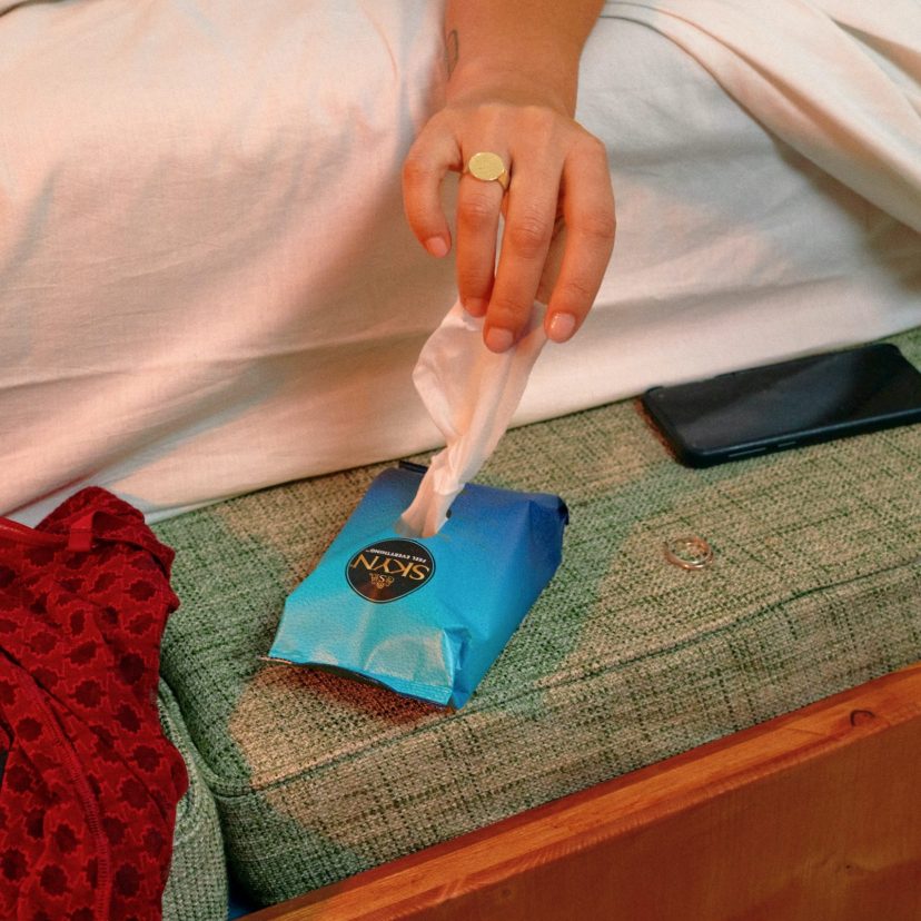 Gril hand reaching over SKYN Get Fresh wipes Gril hand reaching over SKYN Get Fresh wipes