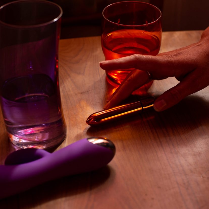 Hand reaching out to SKYN Thrill sex toy Hand reaching out to SKYN Thrill sex toy