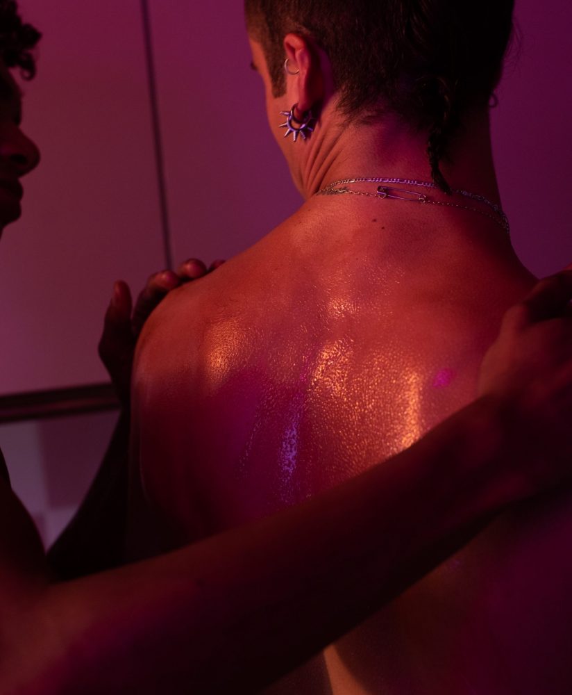 Man bare back hold by another man Man bare back hold by another man